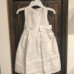 Precious white sleeveless dress with eyelet material.Bonnie Jean